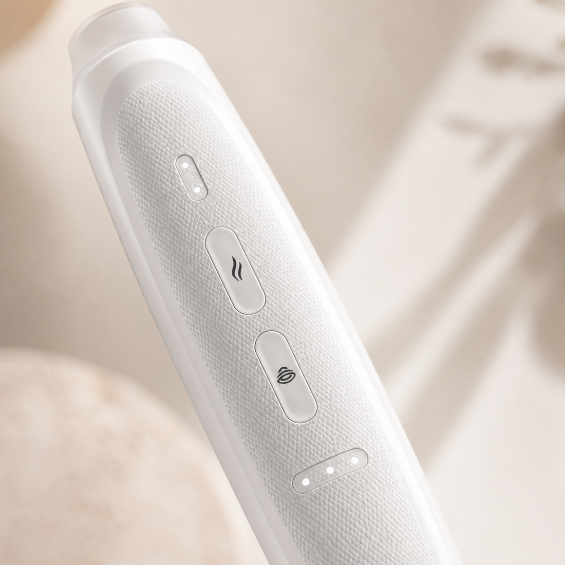 Close-up of Stingtek Dual ceramic heat plate used for bite relief